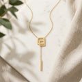 Élan Geometric Drop Necklace in Gold Finish | Minimal Luxury Statement Pendant by VarnamAyira