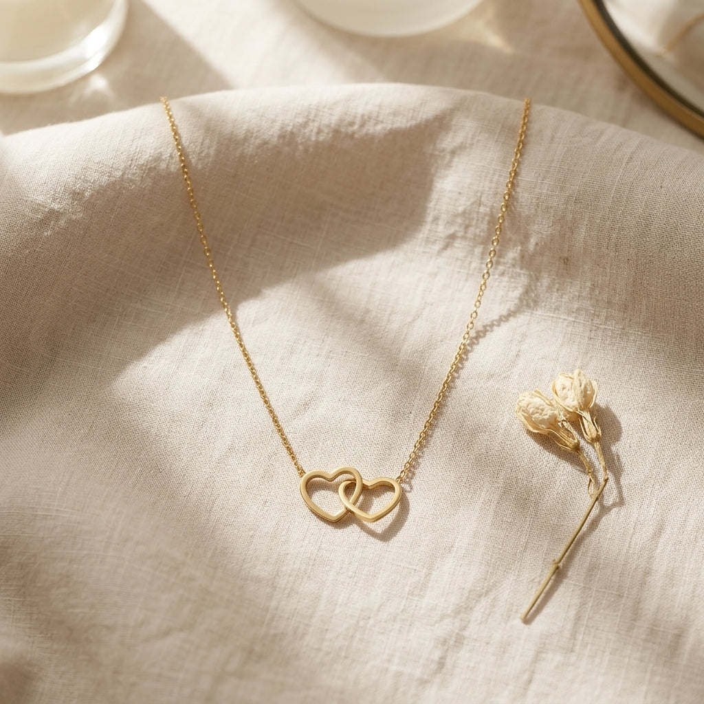 Éternelle Interlocked Hearts Necklace in Dual-Tone Gold Finish | Luxury Couple Heart Pendant by VarnamAyira