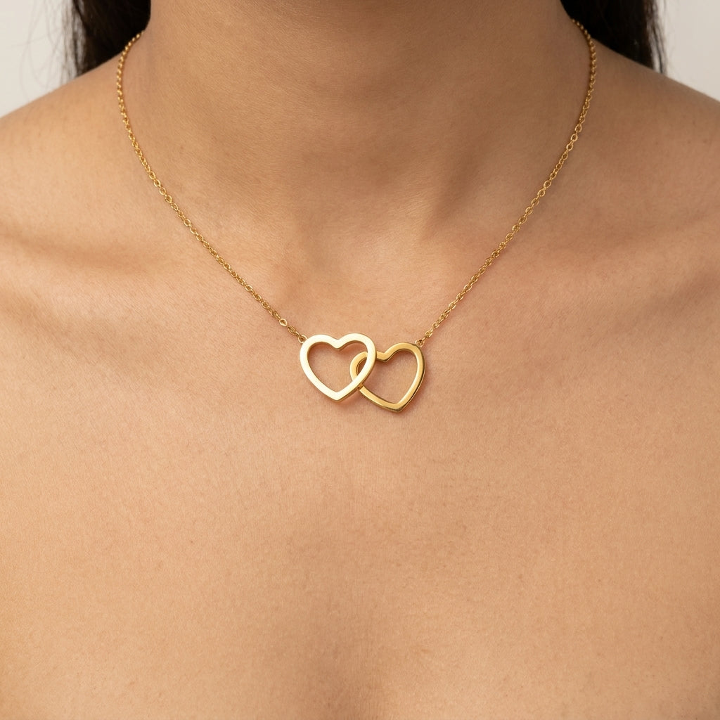 Éternelle Interlocked Hearts Necklace in Dual-Tone Gold Finish | Luxury Couple Heart Pendant by VarnamAyira