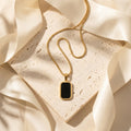 Noiré Onyx Luxe Necklace in Gold Finish | Luxury Black Stone Pendant by VarnamAyira